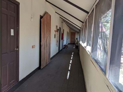Indoor hallway to each of the seven rooms.