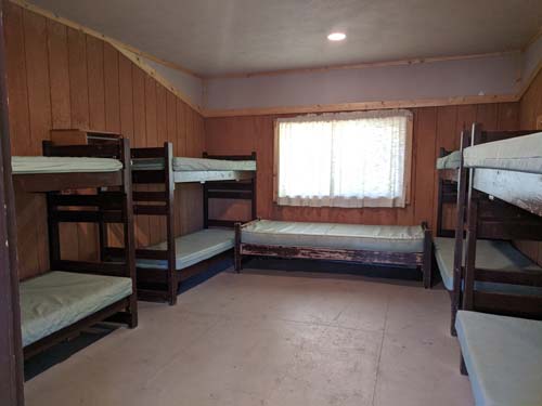 One of the seven rooms with nine bunks in it